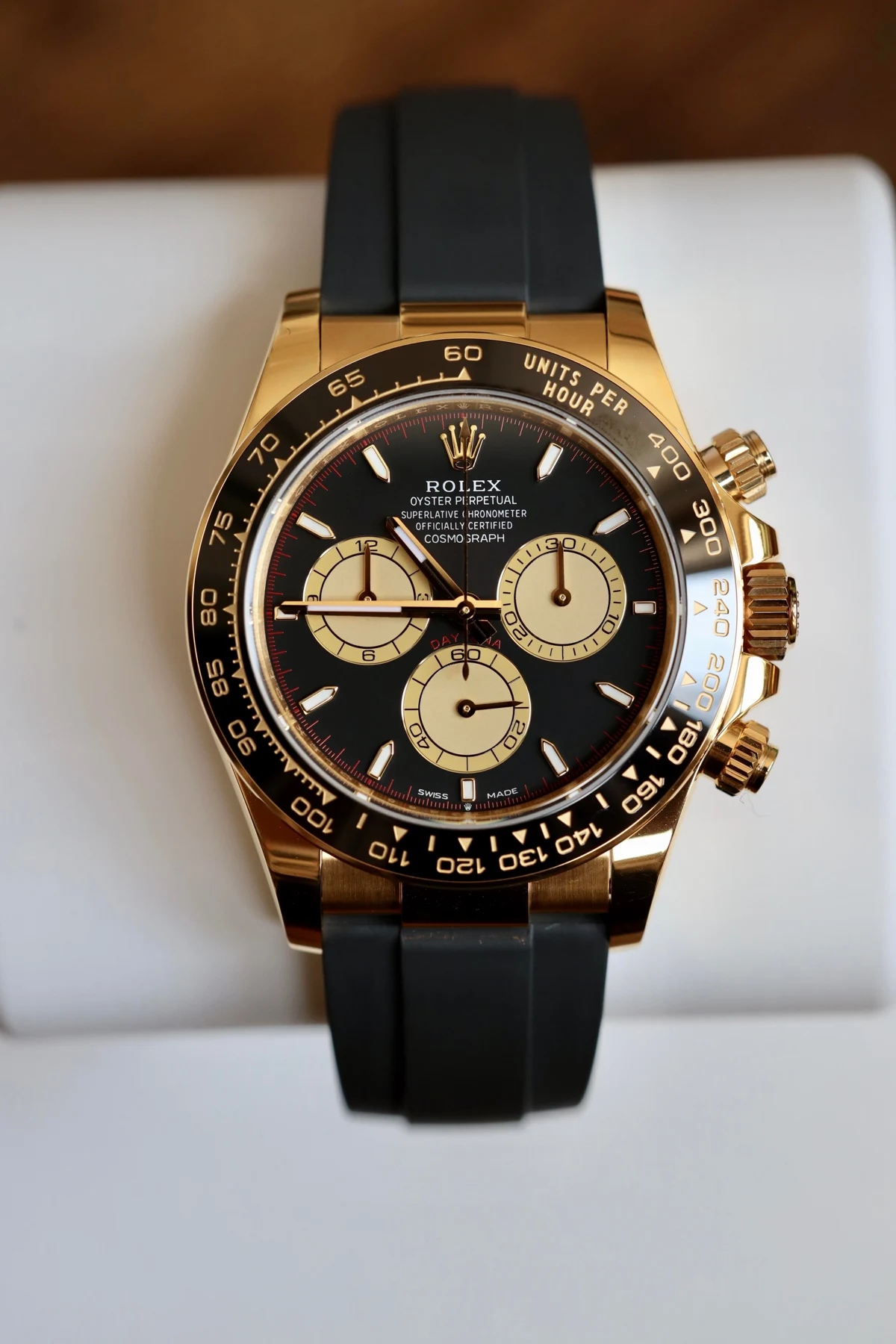 Black & gold chronograph on rubber — full watch view