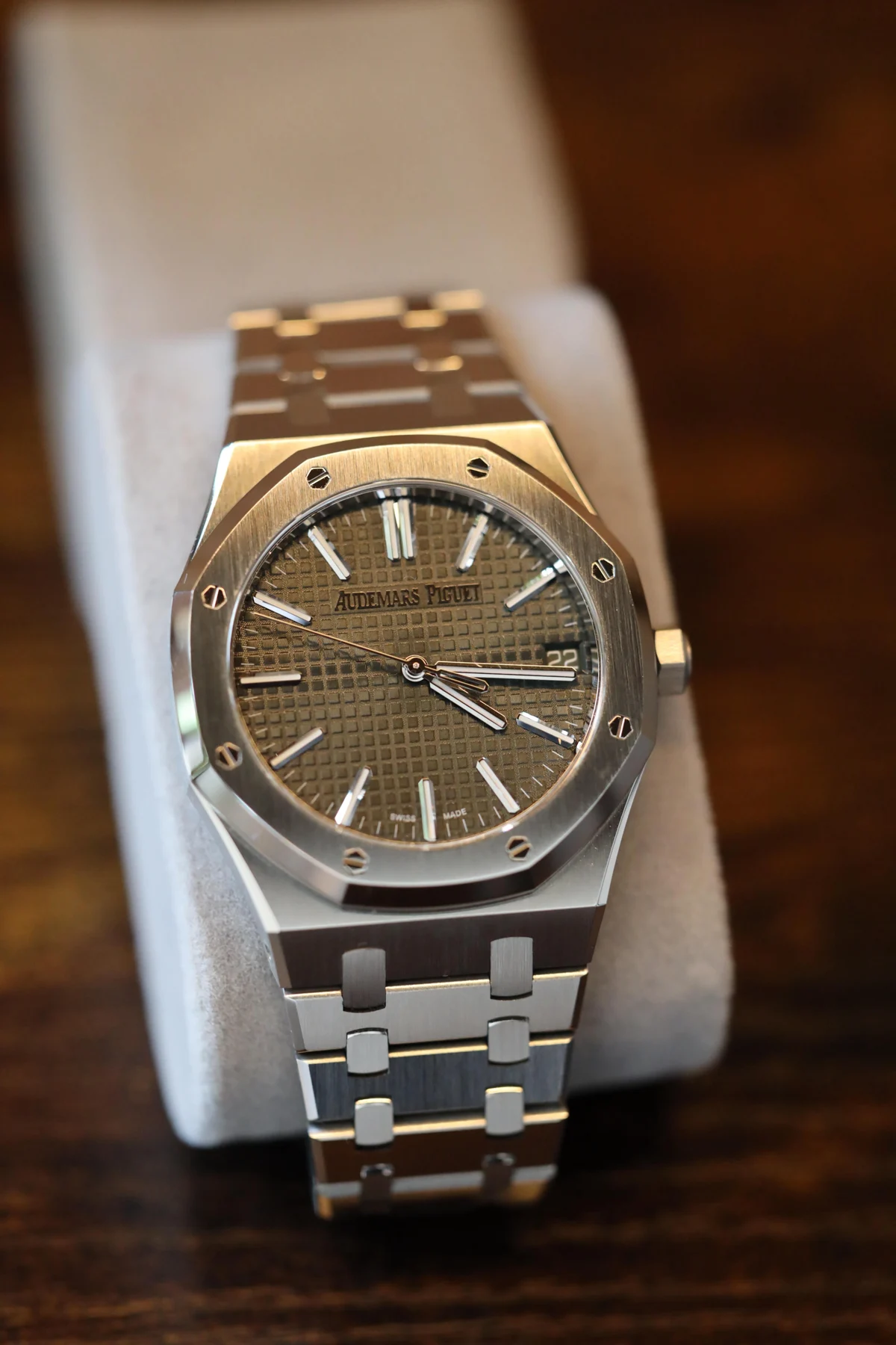 Green dial integrated sports watch — full watch view