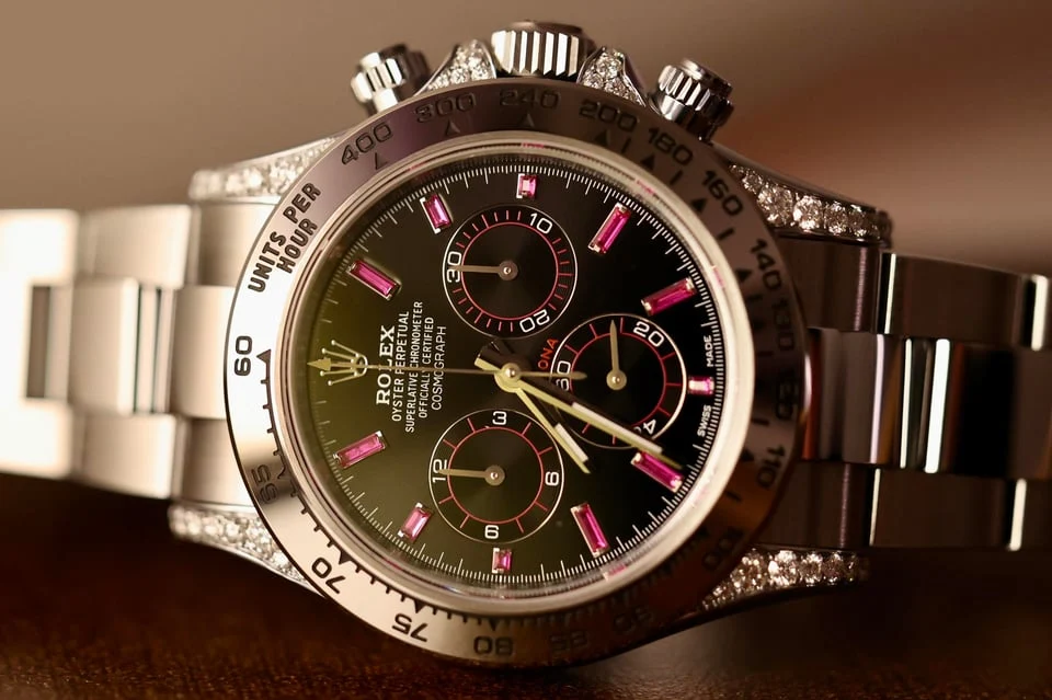 Ruby-accent gem-set chronograph — full watch view