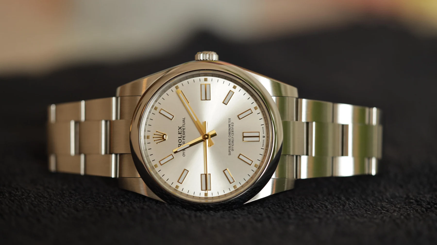 Silver dial, gold markers — full watch view
