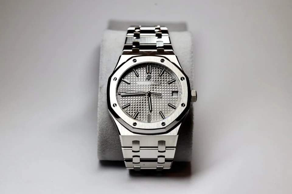 Silver dial integrated sports watch — full watch view