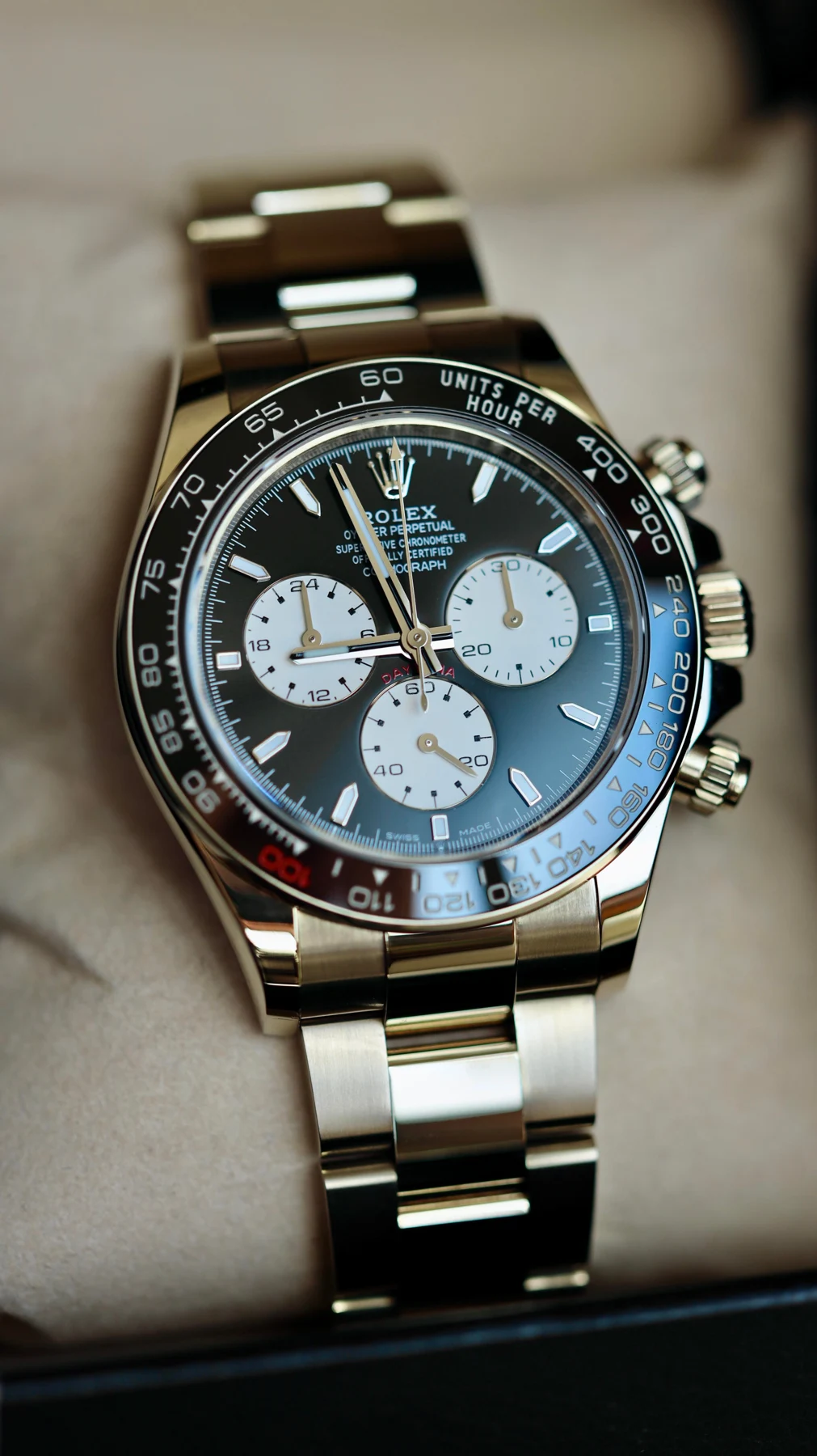 Warm white-gold racing chronograph — full watch view